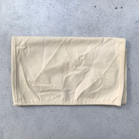 A folded cotton inner bag designed for use with a Produce Pod.