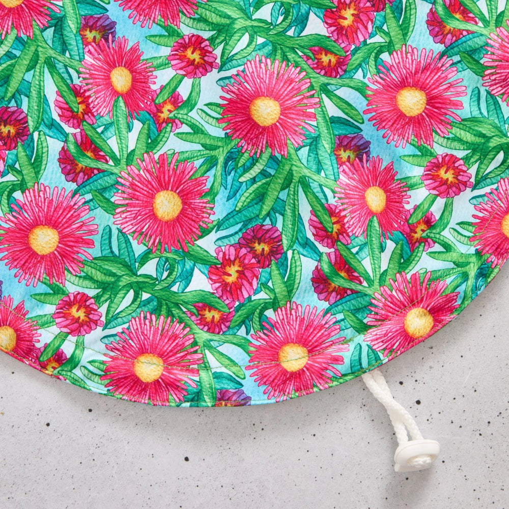Floral-patterned reusable bowl cover on a light grey background
