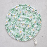 Flat bowl cover with floral pattern on a grey surface