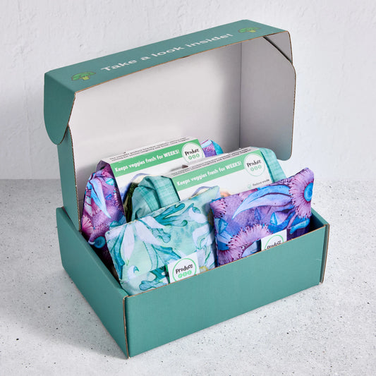 Gift box with reusable produce bags and packaging on a light grey background
