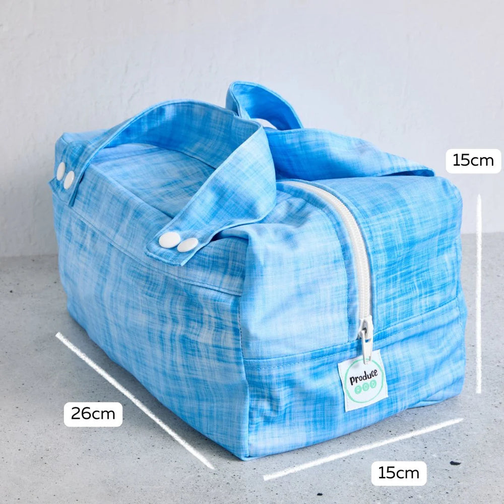 Blue reusable produce bag with measurements on a grey background