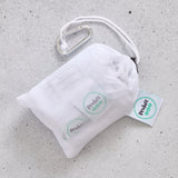 White drawstring bag with carabiner and 'Produce Pod' tags on a grey surface