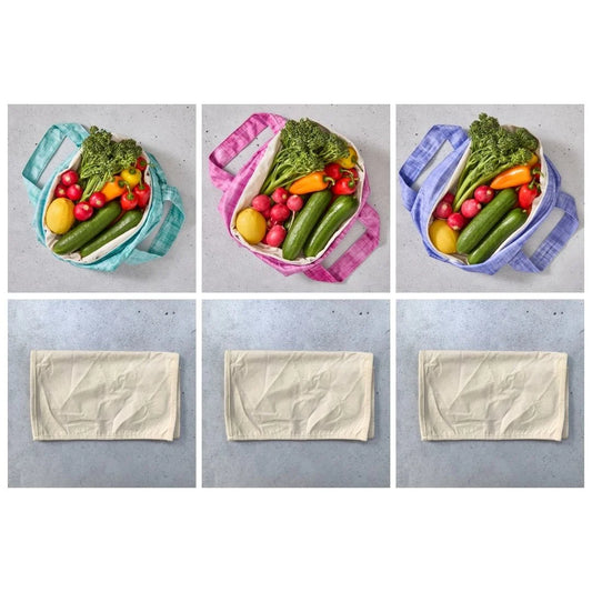 Reusable produce bags filled with vegetables on a grey background