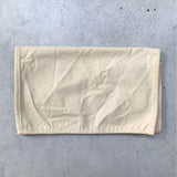 A folded cotton inner bag designed for use with a Produce Pod.