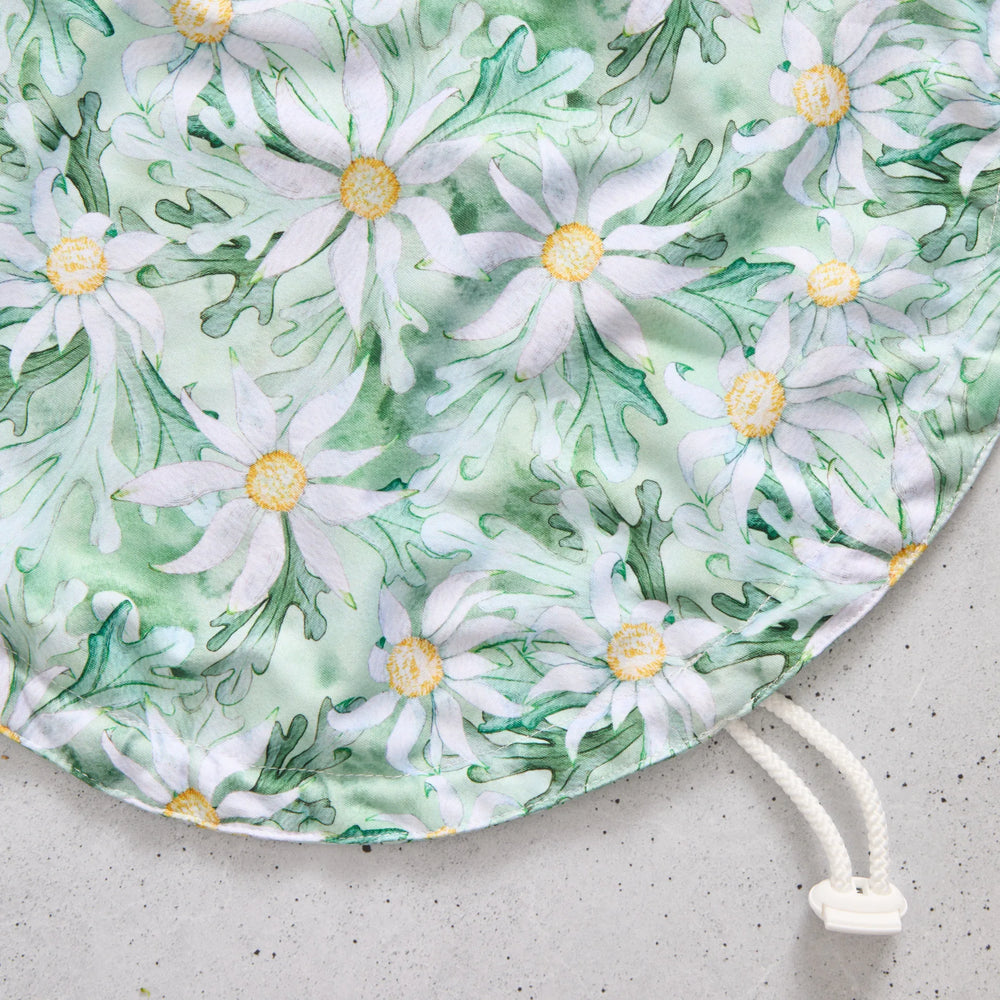 Floral-patterned reusable bowl cover on a light grey background