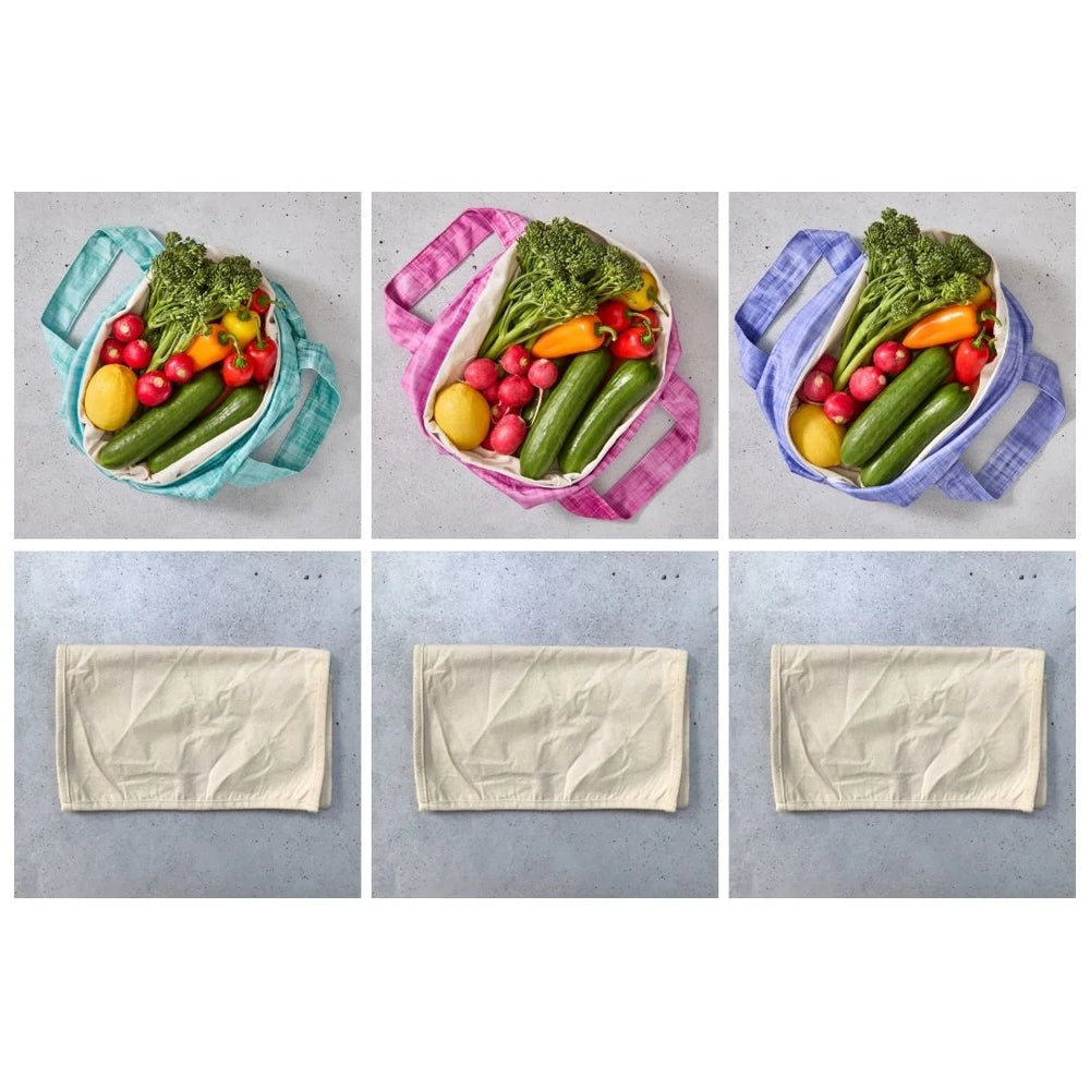 Reusable produce bags filled with vegetables on a grey background